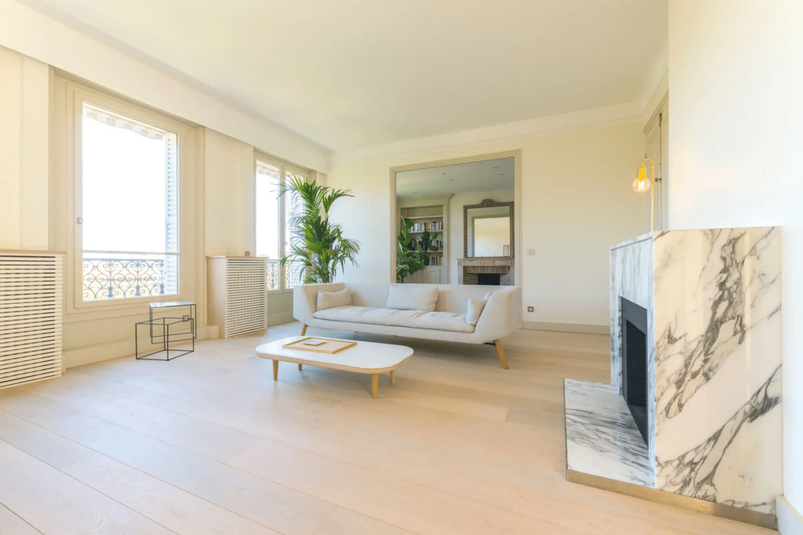 Bright modern living room with marble fireplace