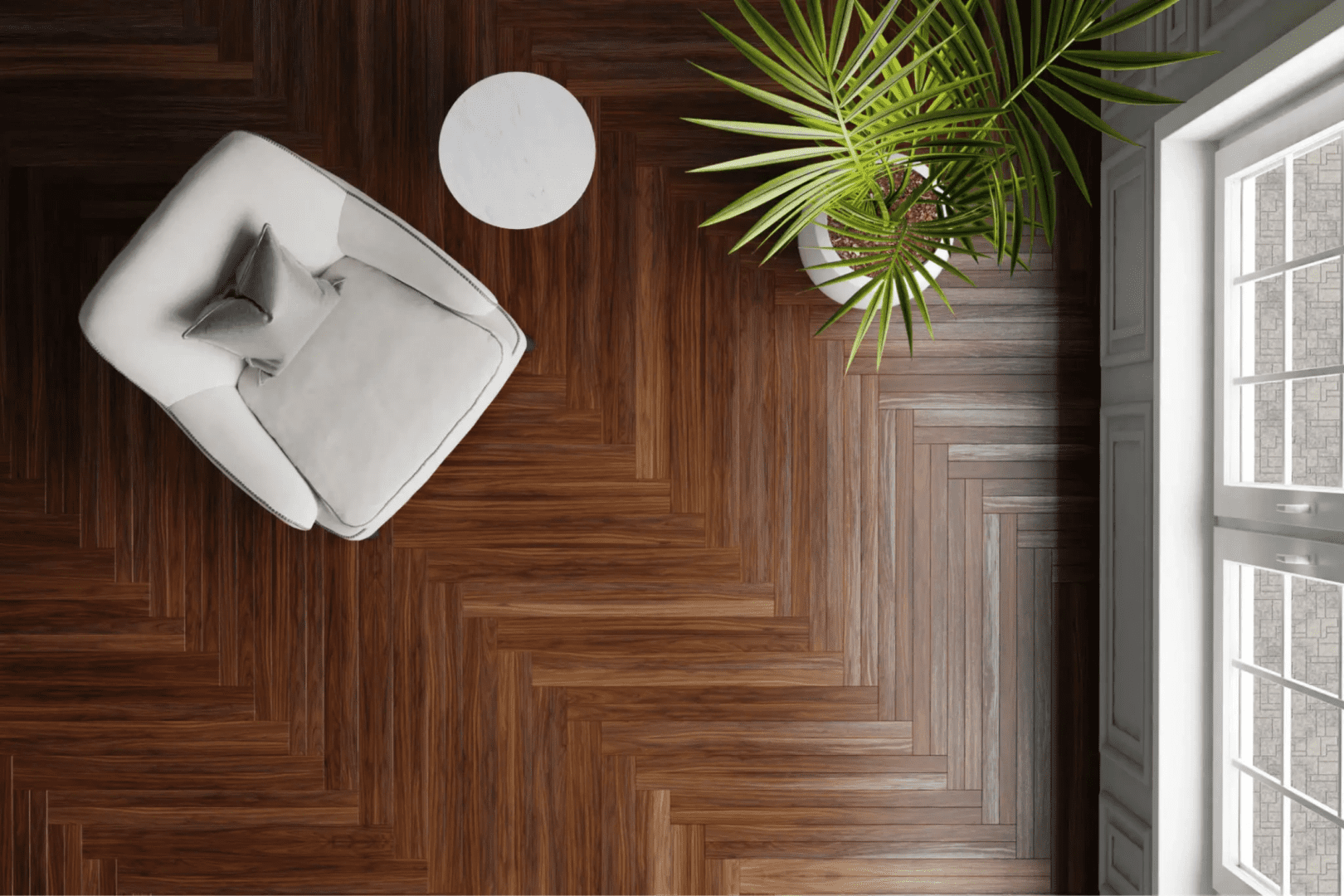 Top-down view: armchair, plant, round table, herringbone floor